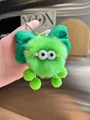 Fluffy emerald green monster keychain with big eyes and bow tie hanging accessory - Green