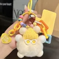 Close-up of plush bear keychain with yellow knit hat and colorful plastic chain detail - Cream