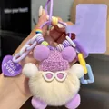 Close-up of plush ball keychain with purple knit hat, sunglasses, and decorative charms - Off-White Purple