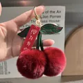 Llavero de cereza en piel sintética con pompones granates y hojas de cuero verde - Burdeos