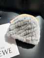 Macro detail of the light gray faux fur texture with elegant wavy knit patterns on the hat - Light Gray