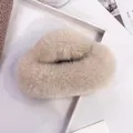 Beige oversized fluffy faux fur hair claw clip in a warm minimalist aesthetic - Milk Tea