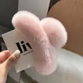 Detailed close-up of the soft pink plush hair claw clip featuring fluffy faux fur texture - Light Pink