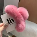 Detail of pink faux rabbit fur hair claw clip showcasing soft fluffy texture for winter - Peach Pink