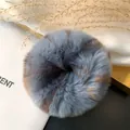 Macro shot of fluffy blue and brown rex rabbit fur scrunchie with soft plush texture - Grey Leopard Print