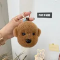 Detailed view of a brown plush teddy bear keychain with a golden spring clip fastener - Brown