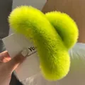 Detailed view of the oversized fluorescent yellow-green faux rabbit fur hair claw clip - Grass Green