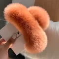 Detail of vibrant orange fluffy faux fur hair claw clip for a soft autumn winter look - Orange Pink