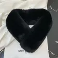 Detailed view of black faux fur scarf with a soft plush texture and crisscross design - 60-80cm / Black