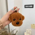 Detailed close-up of brown plush teddy dog keychain with curly faux fur and gold metal ring - Caramel Coffee
