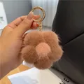 Porte-clés fleur en fourrure de vison marron avec centre rose et anneau doré sur sac - Rose Lotus