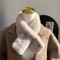 Close-up of soft pink plush faux rabbit fur scarf with a stylish cross-over tuck design - One Size / Milk Tea