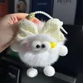 White fluffy plush keychain with a beige bow and large eyes for car keys or bags - White