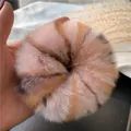 Plush faux rabbit fur oversized scrunchie featuring a soft pink, orange, and grey patchwork - Pink Leopard