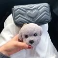 Cute light purple plush teddy dog head keychain hanging on a black leather bag - Gray