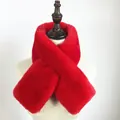 Detail of red faux rabbit fur scarf with cross-loop design on a white mannequin - Red