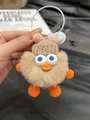 Portachiavi papera di peluche beige con cappello a maglia e soffici arti arancioni - Color Tè al Latte
