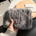 Detailed view of thick grey rabbit fur scarf showing soft fluffy texture and hand grip - Dark Gray