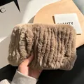 Detail of soft tan rabbit fur neck warmer with thick elastic ribbing and plush texture - Brown