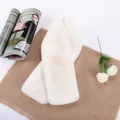 Plush cream faux rabbit fur scarf for winter warmth styled on rustic linen - Off White