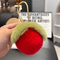 Close-up of red plush peach keychain with soft fur texture and golden metal hook - Red (Water-drop Buckle)