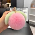 Close-up of soft plush peach keychain with golden ring for bags and car keys - Light Pink (Round Buckle)