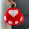 Red and white plush cat paw keychain with heart pattern and golden round metal hook - Red