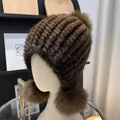 Detail of brown mink fur hat featuring three fluffy fox fur pom-poms and knit texture - One Size Stretchy / Dark Brown
