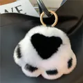 Cute black and white plush cat paw keychain with heart detail and golden metal ring - White + Black