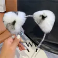 Detailopname van pluche kattenoren haarband in zwart-wit met zachte imitatiebont - Wit Luipaard