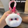 Close-up of a white plush cat keychain with fluffy fur and a woven pink lanyard strap - White