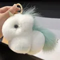 Detail of soft white unicorn plush keychain with mint green mane and golden metal clip - Mint Green (Round Clasp)