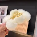 Plush faux rabbit fur claw clip with soft white pom poms and cream resin shark hair clip - Off White