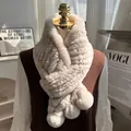 Thick beige rex rabbit fur scarf with decorative pom-poms on an elegant female model - Milk Tea
