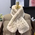 Close-up detail of soft cream rex rabbit fur scarf texture on a brown vest - Milk Tea