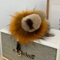 Cute lion plush keychain made of fluffy fur with heart details on a Marshall speaker - Golden Yellow