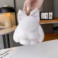 Portachiavi con coniglio di peluche bianco, fiocco glitterato e anello in metallo oro - Bianco