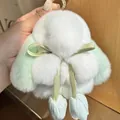 Detail of cute plush bunny charm with mint green ears and sparkling rhinestone ring - Green