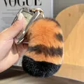 Portachiavi a coda di tigre in vera pelliccia di coniglio con anello dorato - Codina Della Tigre