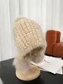 Beige mink fur knit hat for women featuring warm earflaps and three fluffy pom poms - Beige