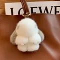 Cute white mink fur rabbit keychain with grey ears and gold stitching on leather bag - Natural Gray Ears Leather Paws