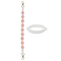 Détail d'une bandoulière tressée à fleurs rose et jaune avec fermoirs dorés et anneau silicone - Anneau en Silicone Blanc + Sangle Rose
