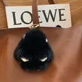 Cute black mink fur rabbit bag charm with golden ring hook on brown leather handbag - Black Leather Paws