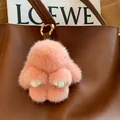 Cute pink mink fur rabbit keychain charm with soft fluffy texture and golden clip - Orange Red Leather Paws