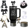 Detail of 40oz black tumbler accessories including alphabet charm, bow cover and boot - Letter A