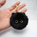 Fluffy black plush cat keychain with yellow eyes and a golden metal ring clasp - Black
