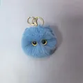 Blue faux fur monster ball keychain with yellow eyes and golden metal lobster clasp - Blue
