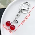 Deep red cherry pearl keychain with silver metal leaves and lobster clasp on white tray - Silver Wine Red Translucent Cherry Style (ER867)