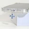 Bijou de portable trèfle argenté avec strass bleu mer pour ports de type C - Trèfle à Diamants