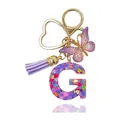 Portachiavi lettera G in resina viola con farfalla, nappa e anello a cuore dorato lucido - Lettera G (Stile 6)